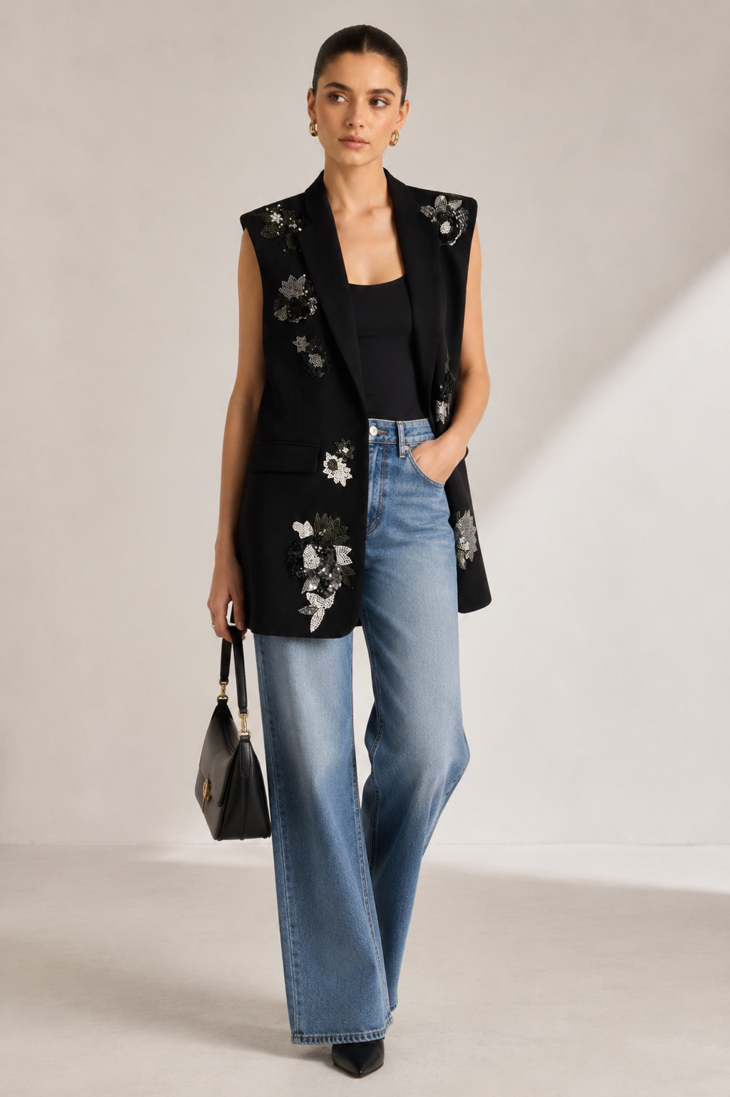 Black embellished longline blazer jacket for women with handcrafted floral sequin embroidery.